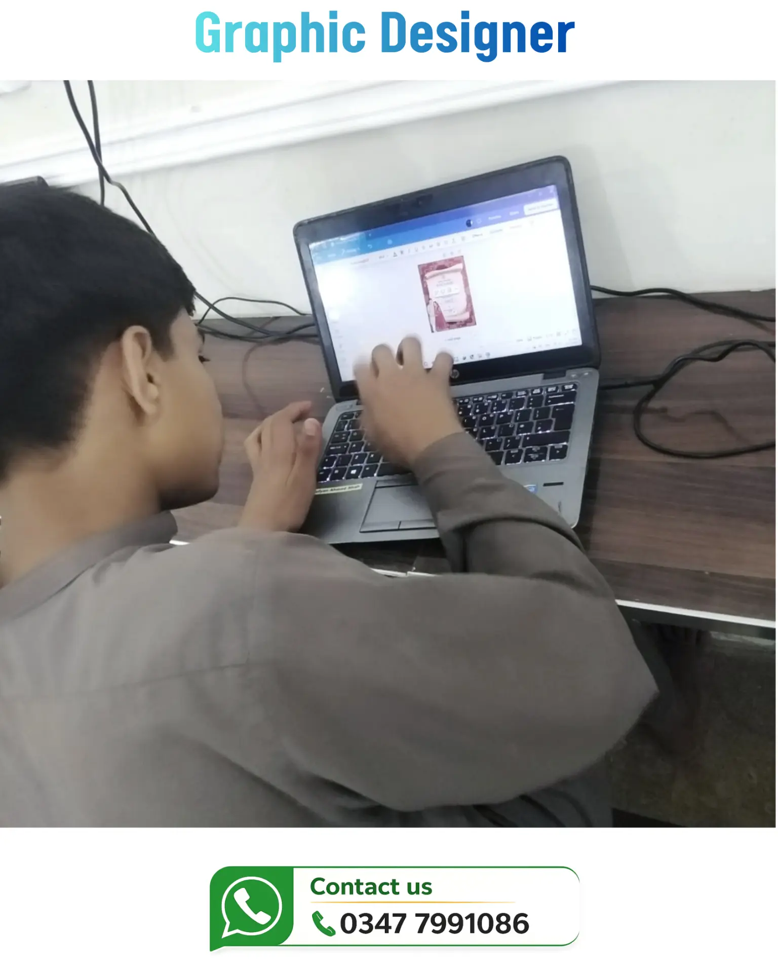 Student designing a flyer on his laptop during graphic design practice