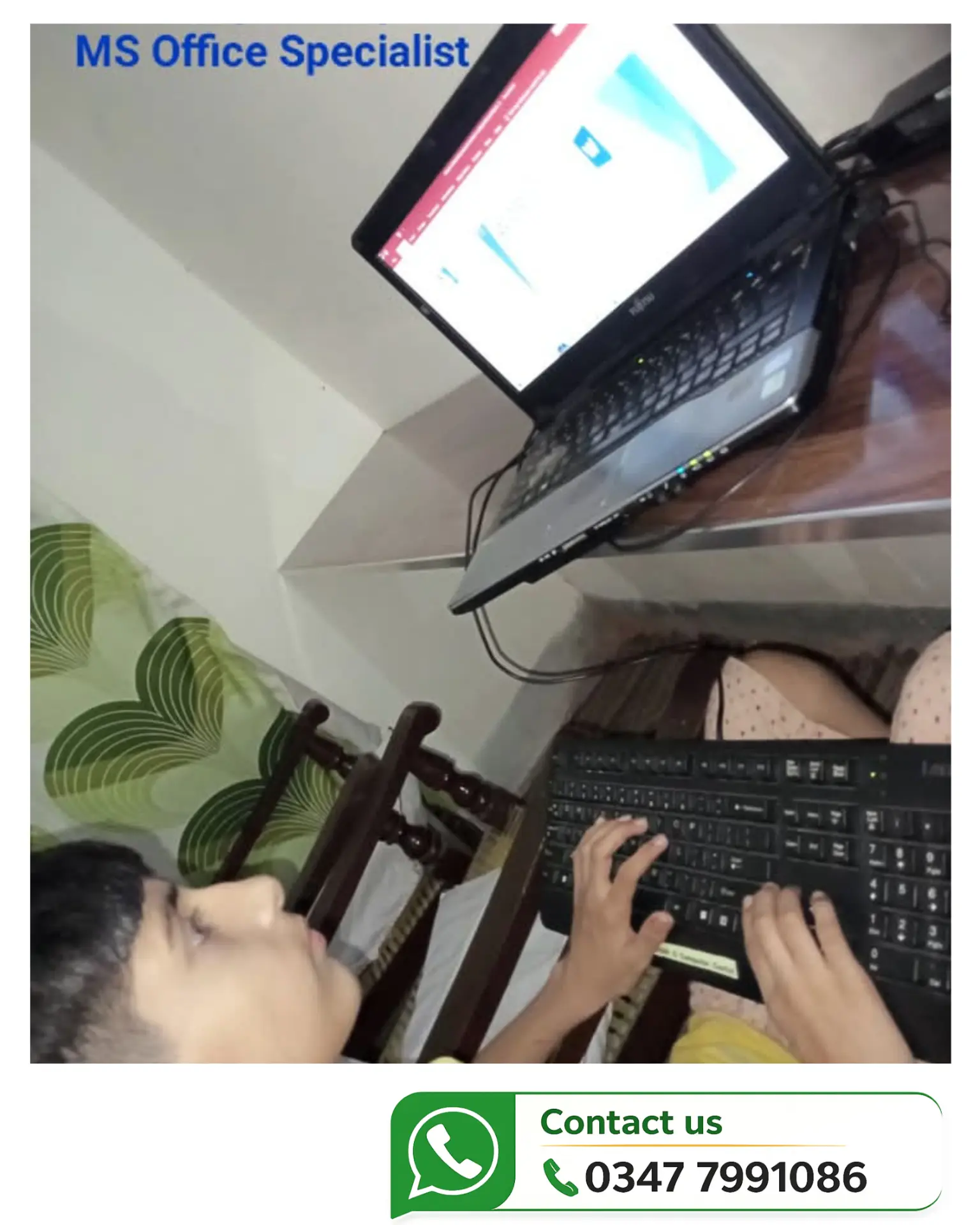 Student practising Microsoft Office work on a laptop and keyboard